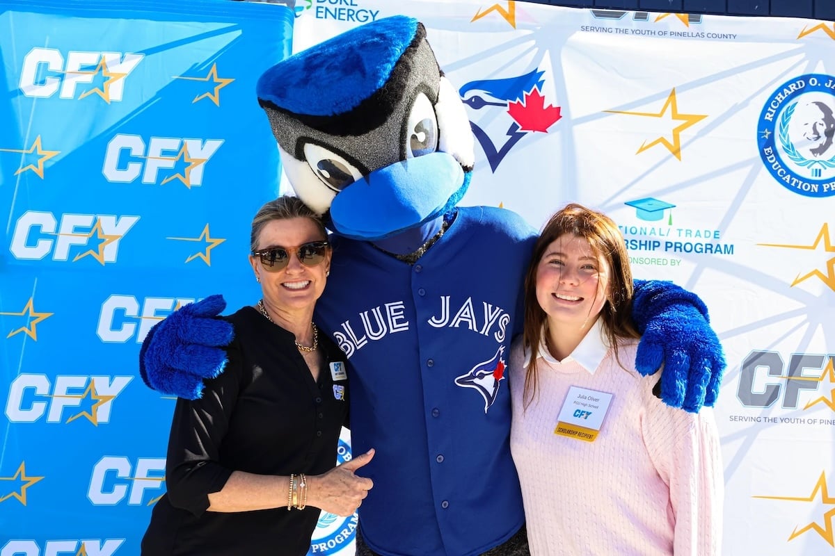 Blue Jays mascot posing with CFY scholarship program attendees at a youth recognition event Blue Jays mascot posing with CFY scholarship program attendees at a youth recognition event