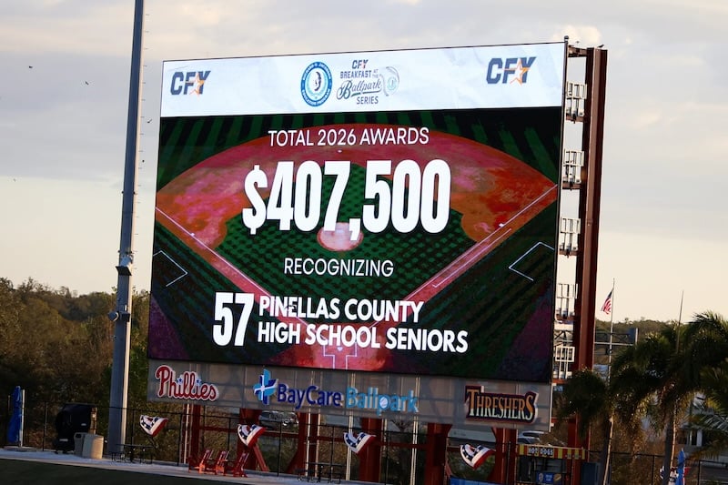 Scoreboard display at BayCare Ballpark recognizing $407,500 in CFY scholarship awards for 57 Pinellas County high school seniors.