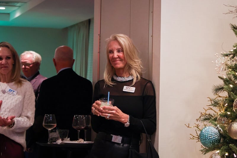 social winter wonderland holding drink