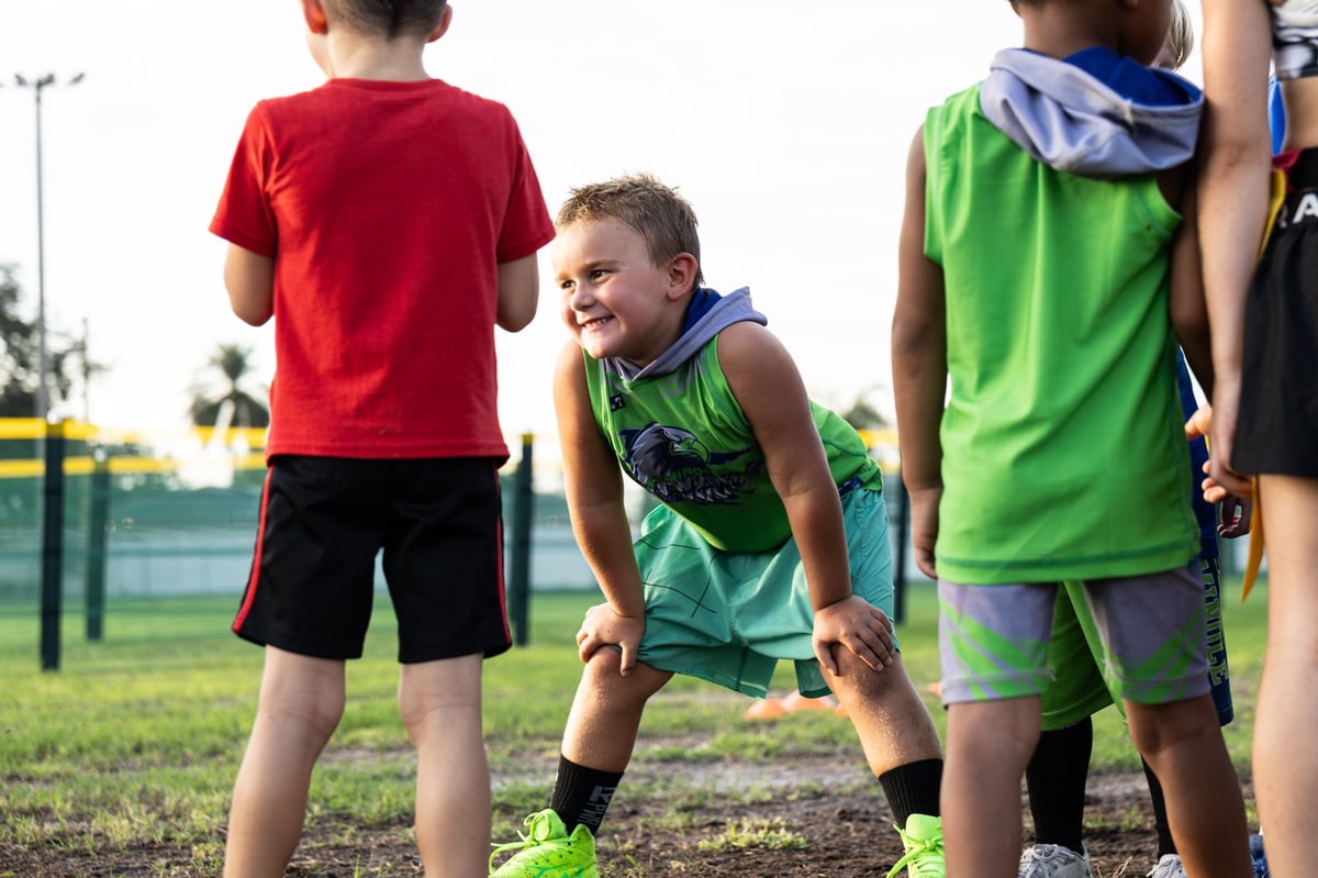 Seminole Seahawks youth football team playing together on the outdoor football field. 